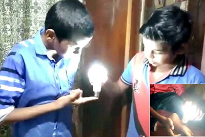Nine-Year-Old Indian Boy Lights LED Bulbs with His Bare Skin