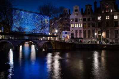 Amsterdam   Bridge  Illuminated  as Van Gogh’s  ‘Starry Night’